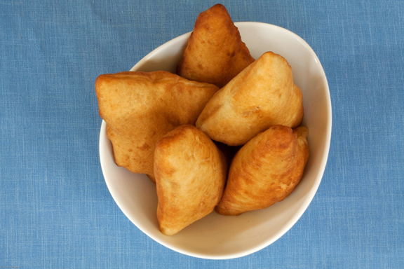 File:Bowl of mandazi.jpg