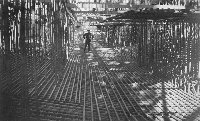 File:Unidentified man standing in steel work for foundation of Legislative Building, Washington State Capitol complex construction (WASTATE 1898).jpeg