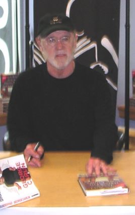 File:George Carlin signing his book, 2004.jpg