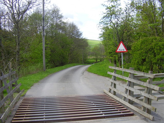 File:Cattle grid across the road - geograph.org.uk - 803955.jpg