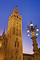 La Giralda, bell tower of the Cathedral of Seville, as viewed from Plaza Virgen de los Reyes in Seville, Spain