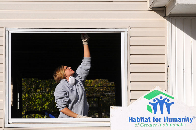 File:US Navy 091021-N-1755G-039 Personnel Specialist 2nd Class Crystal Herald, assigned to Navy Operational Support Center (NOSC) Indianapolis, removes the old seal from a window during a Habitat for Humanity volunteer project.jpg