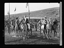 King Ghazi and Emir Saud on horses.