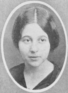 A young white woman with hair parted center and dressed to the nape, in an oval frame