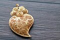 Image 38Typical Portuguese filigree heart shaped pendant, an iconic item in Portuguese fashion and design. (from Culture of Portugal)