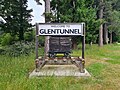 A welcome sign containing a restored coal wagon. December 2023