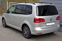 Rear-three-quarter view of a facelifted European Touran; on this model the taillight cluster is partially integrated into the rear hatch