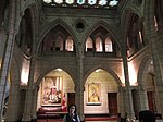 A tour guide waits for people to gather around her in the Senate foyer.