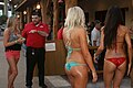 Models in a bikini contest in 2012, captured from behind posing candidly