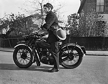 Photo of a telegraph messenger on a motorcycle