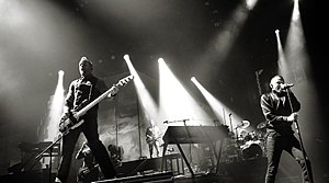 Linkin Park performing in Berlin, in October 2010. From left to right: Joe Hahn, Dave Farrell, Brad Delson, Mike Shinoda, Rob Bourdon and Chester Bennington.