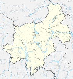 Mapa konturowa powiatu żnińskiego, w centrum znajduje się punkt z opisem „Biskupin”