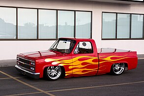 Customized 1985 Chevrolet C10 with a flame paintjob