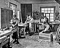 Image 21Students in a carpentry trade school learning woodworking skills, c. 1920 (from Vocational school)