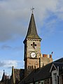 Clock tower, the lower section of which is a remnant of the former town house