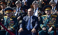 Kazakh President Nursultan Nazarbayev with veterans during the parade