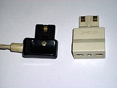 Magic Security plug (10 A) (left) with a type L to Magic Security plug adaptor