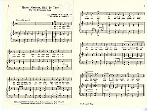 Two sheets of sheet music entitled "Music Masters, Hail to Thee" lie side by side.