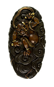 Sword pommel depicting Raijin. Edo period, 1800-1500.