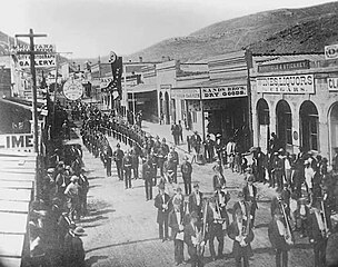 Parade with firemen on Last Chance Gulch, looking south from Broadway — July 4, 1873