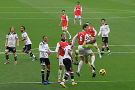 Laurent Koscielny clashes with Heurelho Gomes.jpg