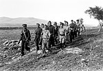 Patrouille des Special Night Squads de retour vers sa base. Les patrouilles, généralement organisées la nuit, étaient mixtes. Les combattants juifs apportaient leur connaissance du terrain, des coutumes de la population et de l'arabe. Les soldats britanniques apportaient leur expérience du combat.