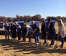 Image of participants with shovels during the ground breaking ceremony