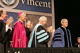 President Bush and several other men wearing academic garb