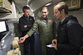 A US Navy airman discusses the capabilities of the P-8A Poseidon aircraft with journalists while flying over the Indian Ocean 4 April/Seorang askar udara Tentera Laut Amerika Syarikat berbincang tentang keupayaan pesawat P-8A Poseidon dengan wartawan ketika penerbangan di Lautan India pada 4 April/4月4日美国海军飞越印度洋时与记者讨论P-8A“海神”的能力。