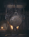 Molten iron being poured into an open hearth furnace