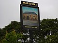 Pub sign at the car park on the opposite side of Holcombe Road.