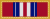 Vertical stripes alternating red, blue, white, blue, white, red, white, blue, white, blue, red with gold border