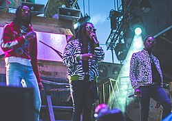 Migos виступають на Veld Festival у 2017 році. Зліва направо: Quavo, Takeoff, and Offset