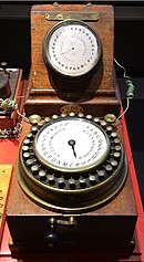 Photo of an ABC telegraph instrument showing letters on a round dial.