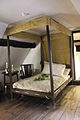 A simple bed of the same period, also English; would also be called a four-poster