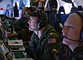 Airmen aboard a US Navy P-8A Poseidon aircraft monitor their workstations while searching the southern Indian Ocean/Askar udara pesawat Tentera Laut Amerika Syarikat P-8A Poiseidon memantau stesen kerja mereka ketika mencari di Laut India selatan/美国海军飞行员驾驶着P-8A“海神”，监视着屏幕用以搜索南印度洋