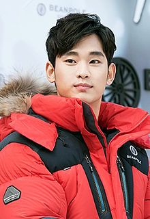 A photograph of Kim Soo-hyun looking at camera