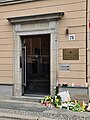 Flowers and signs laid outside the Ukrainian embassy in Berlin to commemorate the victims of the invasion.