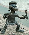 Image 51Statue of Minnie the Minx, a character from The Beano, in Dundee, Scotland. Launched in 1938, The Beano is known for its anarchic humour, with Dennis the Menace appearing on the cover. (from Culture of the United Kingdom)