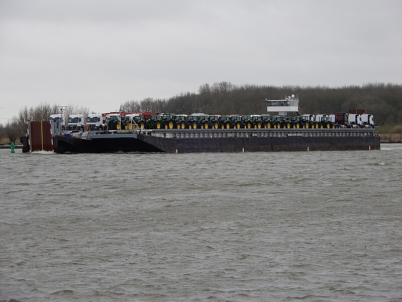 File:Tractors transported by a barge on the Oude Maas river.jpg