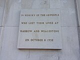 The disaster memorial stone plaque on display at the north entrance of Harrow and Wealdstone railway station