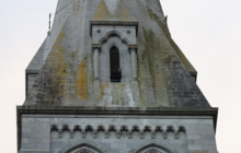 A peregrine falcon perched on the college chapel.