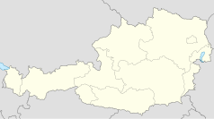 Mapa konturowa Austrii, blisko centrum u góry znajduje się punkt z opisem „Braunau am Inn”