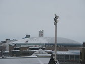 A large building in the center of a city skyline