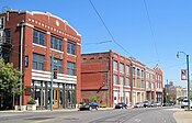 Three-story red brick buildings