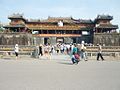 Many tourists are standing in front of Ngọ Môn.