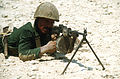 An Egyptian marine aims a Soviet-made RPD 7.62mm light MACHINE GUN during an amphibious assault in support of the multinational joint service Exercise Bright Star '85.