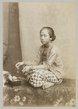 A Javanese woman preparing betel leaf, c. 1880.