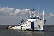 A recovery boat with a recovered Solid Rocket Booster