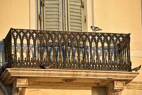 Winged visitors on a small old balcony in Myrina, Lemnos, Greece.